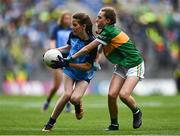 30 July 2023; Hannah O'Connor, Scoil Maelruain Senior, Tallaght, Dublin, representing Dublin, in action against Caoimhe McMahon, Lissycasey NS, Ennis, Clare, representing Kerry, during the INTO Cumann na mBunscol GAA Respect Exhibition Go Games at the GAA Football All-Ireland Senior Championship final match between Dublin and Kerry at Croke Park in Dublin. Photo by Eóin Noonan/Sportsfile