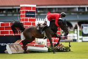 12 August 2023; Pius Schwizer of Switzerland competes on Quilana Denfer during the Defender Puissance during the 2023 Longines FEI Dublin Horse Show at the RDS in Dublin. Photo by David Fitzgerald/Sportsfile