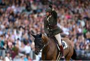 12 August 2023; Commandant Geoff Curran of Ireland celebrates after clearing 2 metres 20 on Bishops Quarter during the Defender Puissance during the 2023 Longines FEI Dublin Horse Show at the RDS in Dublin. Photo by David Fitzgerald/Sportsfile