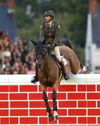 12 August 2023; Commandant Geoff Curran of Ireland competes on Bishops Quarter after winning the Defender Puissance during the 2023 Longines FEI Dublin Horse Show at the RDS in Dublin. Photo by David Fitzgerald/Sportsfile