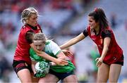 13 August 2023; Caoimhe McGrath of Limerick in action against Meghan Doherty, left, and Niamh Scullion of Down during the 2023 TG4 All-Ireland Ladies Junior Football Championship Final match between Down and Limerick at Croke Park in Dublin. Photo by Piaras Ó Mídheach/Sportsfile
