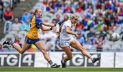 13 August 2023; Lara Gilbert of Kildare kicks a point, undre pressure from Caoimhe Cahill of Clare, during the 2023 TG4 All-Ireland Ladies Intermediate Football Championship Final match between Clare and Kildare at Croke Park in Dublin. Photo by Seb Daly/Sportsfile