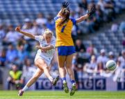 13 August 2023; Neasa Dooley of Kildare takes a shot as Orla Devitt of Clare closes in during the 2023 TG4 All-Ireland Ladies Intermediate Football Championship Final match between Clare and Kildare at Croke Park in Dublin. Photo by Piaras Ó Mídheach/Sportsfile
