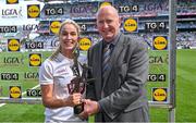 13 August 2023; Roisin Byrne of Kildare receives the Player of the Match award from TG4 head of sport Ronan O Coisdealbha after the 2023 TG4 All-Ireland Ladies Intermediate Football Championship Final match between Clare and Kildare at Croke Park in Dublin. Photo by Seb Daly/Sportsfile