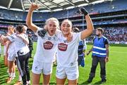 13 August 2023; Kildare players Neasa Dooley, left, and Laoise Lenehan celebrate after their side's victory in the 2023 TG4 All-Ireland Ladies Intermediate Football Championship Final match between Clare and Kildare at Croke Park in Dublin. Photo by Piaras Ó Mídheach/Sportsfile