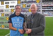 13 August 2023; Hannah Tyrrell of Dublin receives the Player of the Match award from TG4 head of sport Ronan O Coisdealbha after the 2023 TG4 LGFA All-Ireland Senior Championship Final match between Dublin and Kerry at Croke Park in Dublin. Photo by Seb Daly/Sportsfile