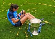 13 August 2023; Player of the match Hannah Tyrrell of Dublin celebrates with her daughter Aoife, age 7 weeks, alongside the Brendan Martin Cup after victory in the 2023 TG4 LGFA All-Ireland Senior Championship Final match between Dublin and Kerry at Croke Park in Dublin. Photo by Piaras Ó Mídheach/Sportsfile