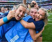 13 August 2023; Lauren Magee of Dublin, centre, celebrates with her team-mates Sinéad Wylde, left, and Caoimhe O'Connor after their side's victory in the 2023 TG4 LGFA All-Ireland Senior Championship Final match between Dublin and Kerry at Croke Park in Dublin. Photo by Piaras Ó Mídheach/Sportsfile