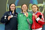 13 August 2023; Mona McSharry of Ireand, centre, celebrates with her gold medal alongside silver medalist Elizabeth Booker of Great Britain, left, and bronze medalist Ana Blazevic after the women's 200m breaststroke final during day three of the European U23 Swimming Championships at the National Aquatic Centre in Dublin. Photo by Tyler Miller/Sportsfile