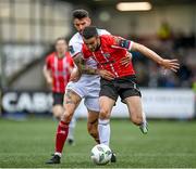 13 August 2023; Michael Duffy of Derry City in action against Adam Foley of Drogheda United during the SSE Airtricity Men's Premier Division match between Derry City and Drogheda United at The Ryan McBride Brandywell Stadium in Derry. Photo by Stephen McCarthy/Sportsfile
