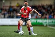 13 August 2023; Michael Duffy of Derry City in action against Adam Foley of Drogheda United during the SSE Airtricity Men's Premier Division match between Derry City and Drogheda United at The Ryan McBride Brandywell Stadium in Derry. Photo by Stephen McCarthy/Sportsfile