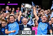 13 August 2023; Dublin players Leah Caffrey, left, and Martha Byrne lift the Brendan Martin Cup after the 2023 TG4 LGFA All-Ireland Senior Championship Final match between Dublin and Kerry at Croke Park in Dublin. Photo by Seb Daly/Sportsfile