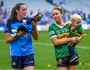 13 August 2023; Hannah Tyrrell of Dublin and her daughter Aoife, age 7 weeks, and Kerry player Louise Galvin with her son Florian Walsh, age 16 months, after the 2023 TG4 LGFA All-Ireland Senior Championship Final match between Dublin and Kerry at Croke Park in Dublin. Photo by Piaras Ó Mídheach/Sportsfile