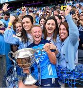 13 August 2023; Dublin captain Carla Rowe celebrates with former team-mates, from left, Sinéad Finnegan, Niamh McEvoy, Lyndsey Davey and Siobhán McGrath after the 2023 TG4 LGFA All-Ireland Senior Championship Final match between Dublin and Kerry at Croke Park in Dublin. Photo by Piaras Ó Mídheach/Sportsfile