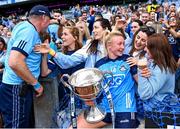 13 August 2023; Dublin captain Carla Rowe and team manager Mick Bohan celebrate with former team-mates, from left, Sinéad Finnegan, Niamh McEvoy, Lyndsey Davey and Siobhán McGrath after the 2023 TG4 LGFA All-Ireland Senior Championship Final match between Dublin and Kerry at Croke Park in Dublin. Photo by Piaras Ó Mídheach/Sportsfile