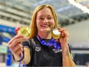 13 August 2023; Mona McSharry of Ireand poses for a portrait with her 50m breaststroke gold medal, 100m breaststroke gold medal and 200m breaststroke gold medal during day three of the European U23 Swimming Championships at the National Aquatic Centre in Dublin. Photo by Tyler Miller/Sportsfile