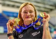 13 August 2023; Mona McSharry of Ireand poses for a portrait with her 50m breaststroke gold medal, 100m breaststroke gold medal and 200m breaststroke gold medal during day three of the European U23 Swimming Championships at the National Aquatic Centre in Dublin. Photo by Tyler Miller/Sportsfile