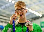 13 August 2023; Daniel Wiffen of Ireand poses for a portrait with his 1500m freestyle gold medal, 400m freestyle silver medal and 800m freestyle silver medal during day three of the European U23 Swimming Championships at the National Aquatic Centre in Dublin. Photo by Tyler Miller/Sportsfile