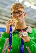 13 August 2023; Daniel Wiffen of Ireand poses for a portrait with his 1500m freestyle gold medal during day three of the European U23 Swimming Championships at the National Aquatic Centre in Dublin. Photo by Tyler Miller/Sportsfile