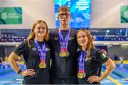 13 August 2023; Ireland athletes, left, Mona McSharry, Daniel Wiffen and Ellen Walshe pose for a portrait with their medals during day three of the European U23 Swimming Championships at the National Aquatic Centre in Dublin. Photo by Tyler Miller/Sportsfile