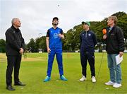 14 Augut 2023; Leinster Lightning captain George Dockrell, second from left, tosses the coin alongside North West Warriors captain Andy McBrine, HBV Studios commentator Craig Senior, right, and Match Referee Graham McRea before the Rario Inter-Provincial Cup match between Leinster Lightning and North West Warriors at The Hills Cricket Club in Dublin. Photo by Tyler Miller/Sportsfile