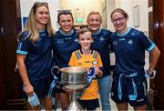 14 August 2023; Daniel Hayes, age 11, from Kilmihil, Clare with Dublin ladies players, from left, Grainne Fitzsimons, Leah Caffrey, Carla Rowe and Orlagh Nolan and the Brendan Martin Cup on a visit to CHI at Temple Street, Dublin. Photo by David Fitzgerald/Sportsfile