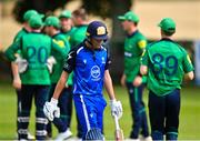 14 Augut 2023; Tim Tector of Leinster Lightning leaves the pitch after being caught out by Craig Young of North West Warriors during the Rario Inter-Provincial Cup match between Leinster Lightning and North West Warriors at The Hills Cricket Club in Dublin. Photo by Tyler Miller/Sportsfile
