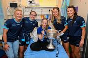14 August 2023; Katie Kelly, age 16, from Skeheenarinky, Tipperary with Dublin ladies players, from left, Carla Rowe, Orlagh Nolan, Grainne Fitzsimons and Leah Caffrey and the Brendan Martin Cup on a visit to CHI at Temple Street, Dublin. Photo by David Fitzgerald/Sportsfile
