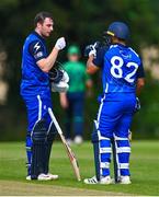 14 Augut 2023; Lorcan Tucker of Leinster Lightning, left, is congratulated by teammate Chris De Freitas after bringing up his half century of runs during the Rario Inter-Provincial Cup match between Leinster Lightning and North West Warriors at The Hills Cricket Club in Dublin. Photo by Tyler Miller/Sportsfile