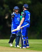 14 Augut 2023; Chris De Freitas of Leinster Lightning, left, is congratulated by teammate Lorcan Tucker after bringing up his half century of runs during the Rario Inter-Provincial Cup match between Leinster Lightning and North West Warriors at The Hills Cricket Club in Dublin. Photo by Tyler Miller/Sportsfile