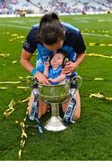 13 August 2023; Player of the match Hannah Tyrrell of Dublin celebrates with her daughter Aoife, age 7 weeks, and the Brendan Martin Cup after victory in the 2023 TG4 LGFA All-Ireland Senior Championship Final match between Dublin and Kerry at Croke Park in Dublin. Photo by Piaras Ó Mídheach/Sportsfile