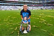 13 August 2023; Player of the match Hannah Tyrrell of Dublin celebrates with her daughter Aoife, age 7 weeks, and the Brendan Martin Cup after victory in the 2023 TG4 LGFA All-Ireland Senior Championship Final match between Dublin and Kerry at Croke Park in Dublin. Photo by Piaras Ó Mídheach/Sportsfile