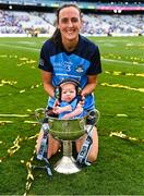 13 August 2023; Player of the match Hannah Tyrrell of Dublin celebrates with her daughter Aoife, age 7 weeks, and the Brendan Martin Cup after victory in the 2023 TG4 LGFA All-Ireland Senior Championship Final match between Dublin and Kerry at Croke Park in Dublin. Photo by Piaras Ó Mídheach/Sportsfile