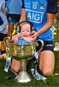 13 August 2023; Player of the match Hannah Tyrrell of Dublin celebrates with her daughter Aoife, age 7 weeks, and the Brendan Martin Cup after victory in the 2023 TG4 LGFA All-Ireland Senior Championship Final match between Dublin and Kerry at Croke Park in Dublin. Photo by Piaras Ó Mídheach/Sportsfile