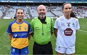 13 August 2023; Referee Gus Chapman with team captains Caoimhe Harvey of Clare and Grace Clifford of Kildare before the 2023 TG4 All-Ireland Ladies Intermediate Football Championship Final match between Clare and Kildare at Croke Park in Dublin. Photo by Piaras Ó Mídheach/Sportsfile