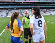 13 August 2023; Referee Gus Chapman performs the coin toss with team captains Caoimhe Harvey of Clare and Grace Clifford of Kildare before the 2023 TG4 All-Ireland Ladies Intermediate Football Championship Final match between Clare and Kildare at Croke Park in Dublin. Photo by Piaras Ó Mídheach/Sportsfile