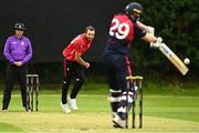 15 August 2023; Liam McCarthy of Munster Reds delivers to Morgan Topping of Northern Knights during the Rario Inter-Provincial Cup match between Munster Reds and Northern Knights at The Mardyke in Cork. Photo by Eóin Noonan/Sportsfile
