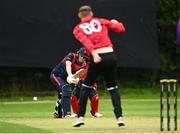 15 August 2023; Ben White of Munster Reds delivers to Neil Rock of Northern Knights to hits his century during the Rario Inter-Provincial Cup match between Munster Reds and Northern Knights at The Mardyke in Cork. Photo by Eóin Noonan/Sportsfile