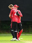 15 August 2023; Josh Manley, left, celebrates with PJ Moore of Munster Reds after bowling out Matthew Humphreys of Northern Knights during the Rario Inter-Provincial Cup match between Munster Reds and Northern Knights at The Mardyke in Cork. Photo by Eóin Noonan/Sportsfile