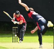 15 August 2023; Mark Adair of Northern Knights delivers to Matt Ford of Munster Reds during the Rario Inter-Provincial Cup match between Munster Reds and Northern Knights at The Mardyke in Cork. Photo by Eóin Noonan/Sportsfile