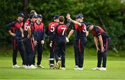 15 August 2023; Northern Knights players celebrate after bowling out Mike Frost of Munster Reds during the Rario Inter-Provincial Cup match between Munster Reds and Northern Knights at The Mardyke in Cork. Photo by Eóin Noonan/Sportsfile