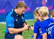16 August 2023; Leinster player John McKee signs autographs during the Bank of Ireland Leinster rugby summer camp at Energia Park in Dublin. Photo by Piaras Ó Mídheach/Sportsfile