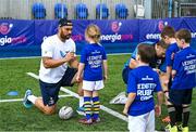 16 August 2023; Leinster players Charlie Ngatai, left, and John McKee sign autographs during the Bank of Ireland Leinster rugby summer camp at Energia Park in Dublin. Photo by Piaras Ó Mídheach/Sportsfile