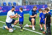 16 August 2023; Leinster players Charlie Ngatai, left, and John McKee with children during the Bank of Ireland Leinster rugby summer camp at Energia Park in Dublin. Photo by Piaras Ó Mídheach/Sportsfile