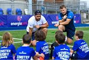 16 August 2023; Leinster players Charlie Ngatai, left, and John McKee with children during the Bank of Ireland Leinster rugby summer camp at Energia Park in Dublin. Photo by Piaras Ó Mídheach/Sportsfile