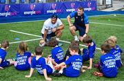 16 August 2023; Leinster players John McKee, right, and Charlie Ngatai with children during the Bank of Ireland Leinster rugby summer camp at Energia Park in Dublin. Photo by Piaras Ó Mídheach/Sportsfile