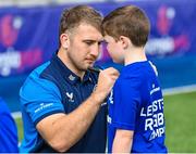 16 August 2023; Leinster player John McKee signs an autograph during the Bank of Ireland Leinster rugby summer camp at Energia Park in Dublin. Photo by Piaras Ó Mídheach/Sportsfile