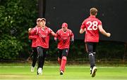 17 August 2023; Josh Manley of Munster Reds celebrates with team-mates after bowling out Cormac McLoughlin-Gavin of Leinster Lightning during the Rario Inter-Provincial Cup match between Munster Reds and Leinster Lightning at The Mardyke in Cork. Photo by Eóin Noonan/Sportsfile
