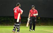 17 August 2023; Ali Frost of Munster Reds, right, and team-mate Tyrone Kane during the Rario Inter-Provincial Cup match between Munster Reds and Leinster Lightning at The Mardyke in Cork. Photo by Eóin Noonan/Sportsfile