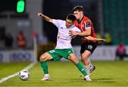 17 August 2023; Serikzhan Muzhikov of Tobol in action against Adam O'Reilly of Derry City during the UEFA Europa Conference League Third Qualifying Round second leg match between Derry City and FC Tobol at Tallaght Stadium in Dublin. Photo by Ben McShane/Sportsfile